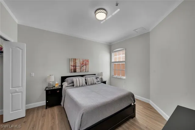 a bedroom with a bed and a desk