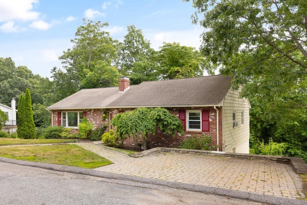 7 Riverview Avenue Maynard, MA 01754 - Photo 1 of 35 a view of a house with a yard and large tree