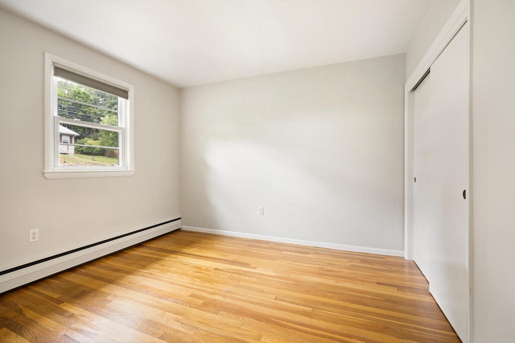 7 Riverview Avenue Maynard, MA 01754 - Photo 13 of 35 a view of empty room with wooden floor