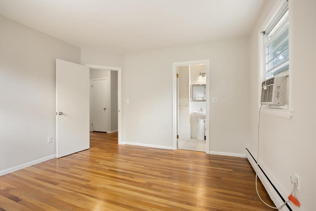 7 Riverview Avenue Maynard, MA 01754 - Photo 17 of 35 a view of an empty room with wooden floor