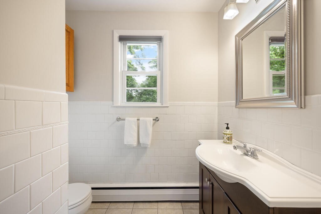 7 Riverview Avenue Maynard, MA 01754 - Photo 23 of 35 a bathroom with a sink toilet and window