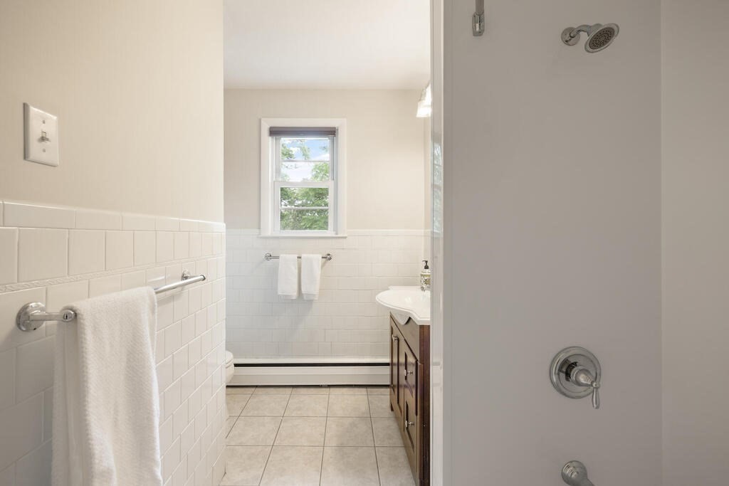 7 Riverview Avenue Maynard, MA 01754 - Photo 24 of 35 a bathroom with a granite countertop shower and a sink