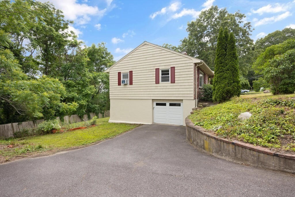 7 Riverview Avenue Maynard, MA 01754 - Photo 27 of 35 a view of a house with a backyard and a tree