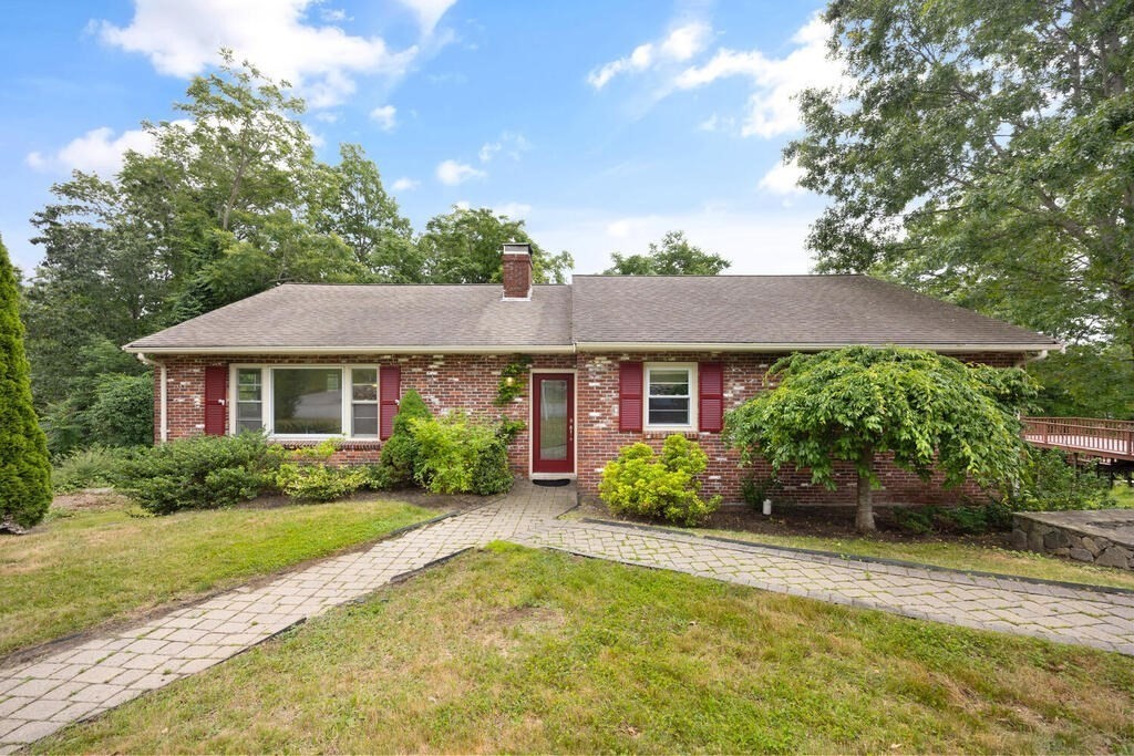 7 Riverview Avenue Maynard, MA 01754 - Photo 33 of 35 a front view of a house with a yard