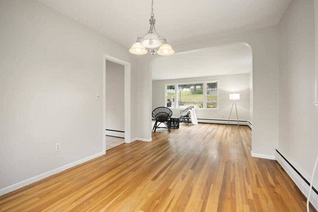 7 Riverview Avenue Maynard, MA 01754 - Photo 9 of 35 a furnished livingroom with windows and wooden floor