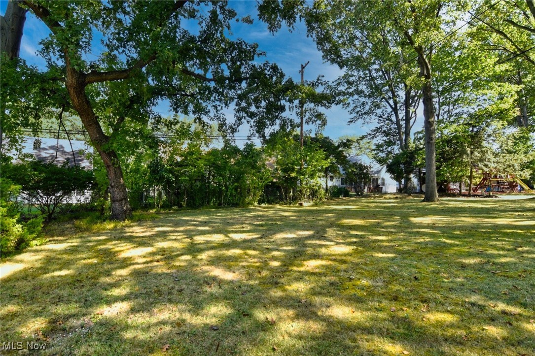 3679 Fenley Road Cleveland Heights, OH 44121 - Photo 41 of 45 View of green lawn featuring a playground
