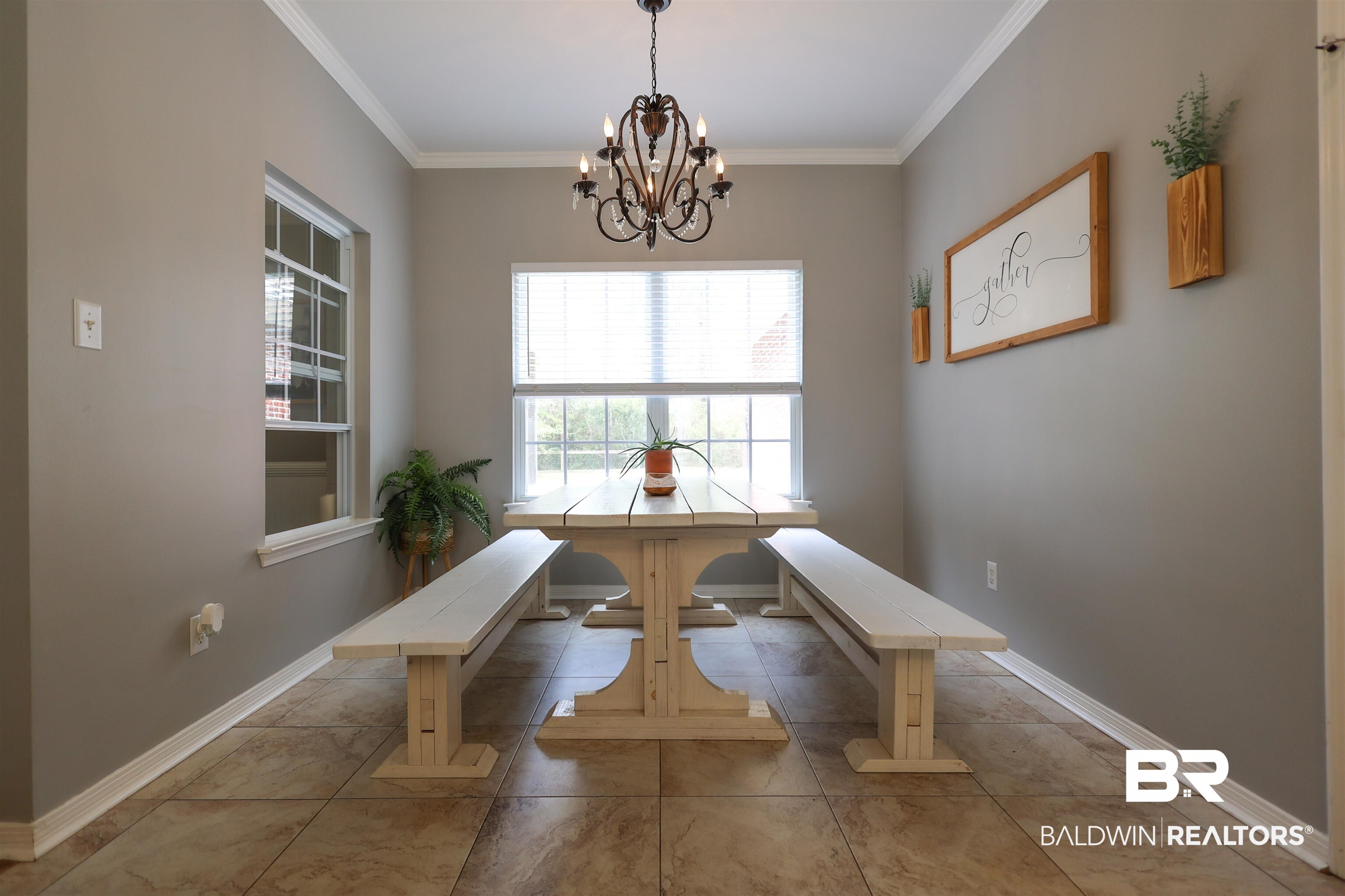 5151 Beatrice Road Gulf Shores, AL 36542 - Photo 13 of 50 Dining room with crown molding and hanging lights