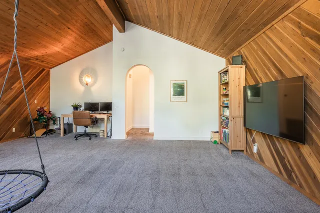 a bedroom with bed and a window