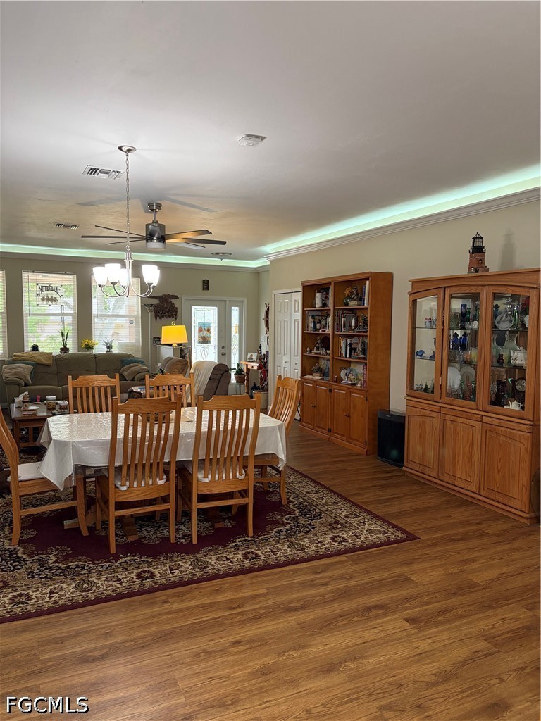 92 Evergreen Road North Fort Myers, FL 33903 - Photo 14 of 30 a view of a porch with furniture and wooden floor