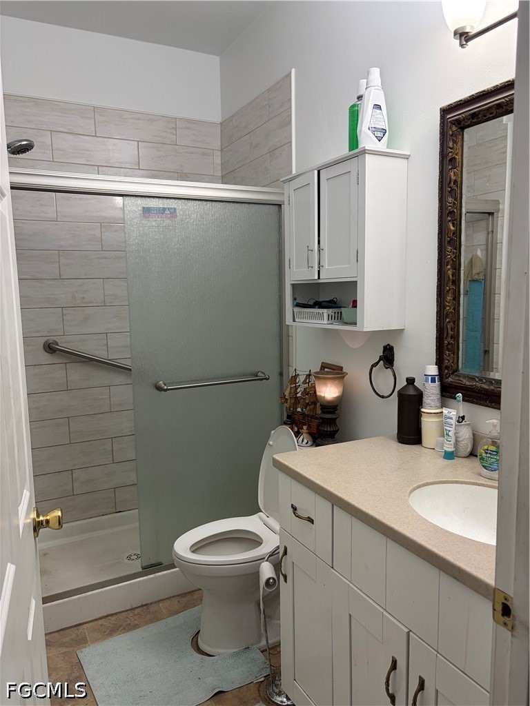 92 Evergreen Road North Fort Myers, FL 33903 - Photo 28 of 30 a bathroom with a toilet a sink and shower