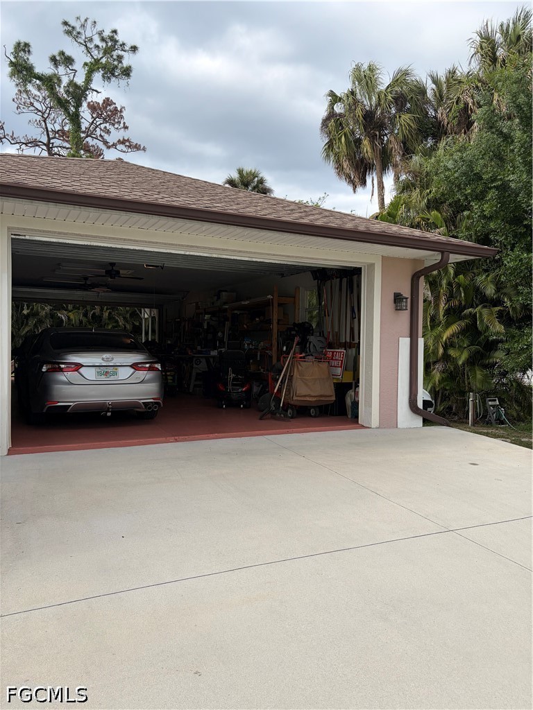 92 Evergreen Road North Fort Myers, FL 33903 - Photo 29 of 30 a view of car parked in garage