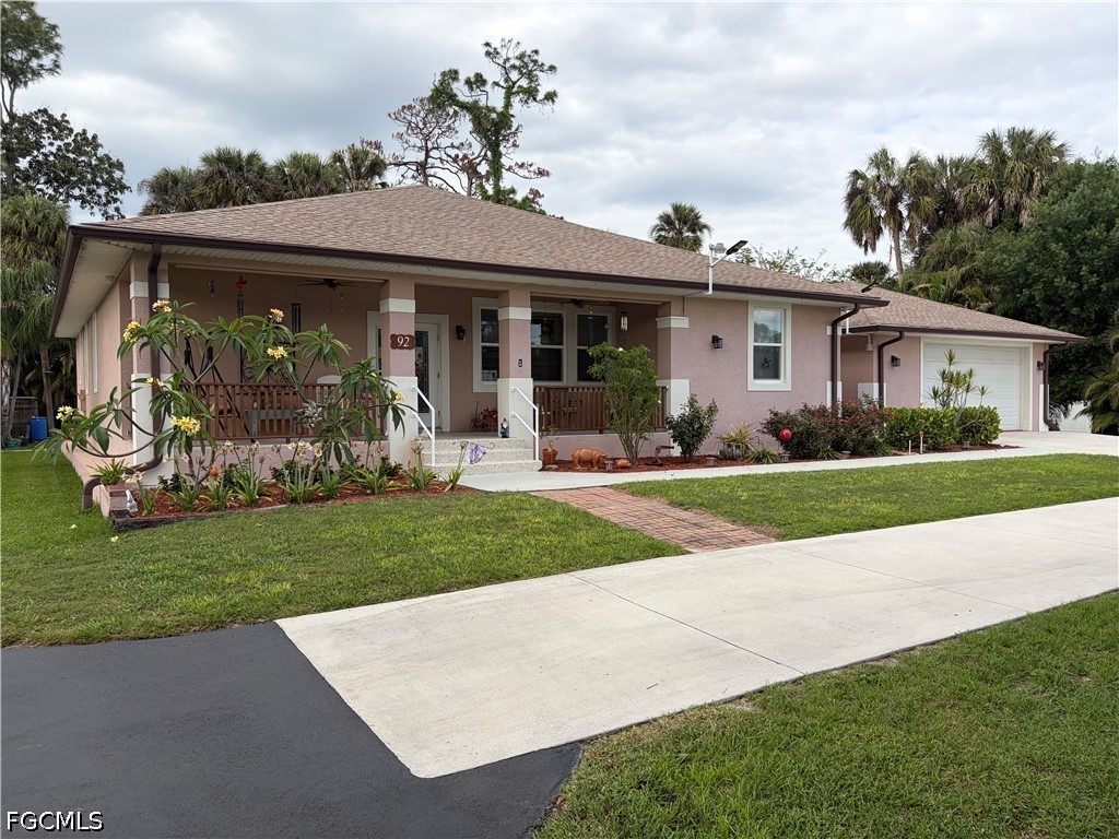 92 Evergreen Road North Fort Myers, FL 33903 - Photo 5 of 30 a view of a house with a garden