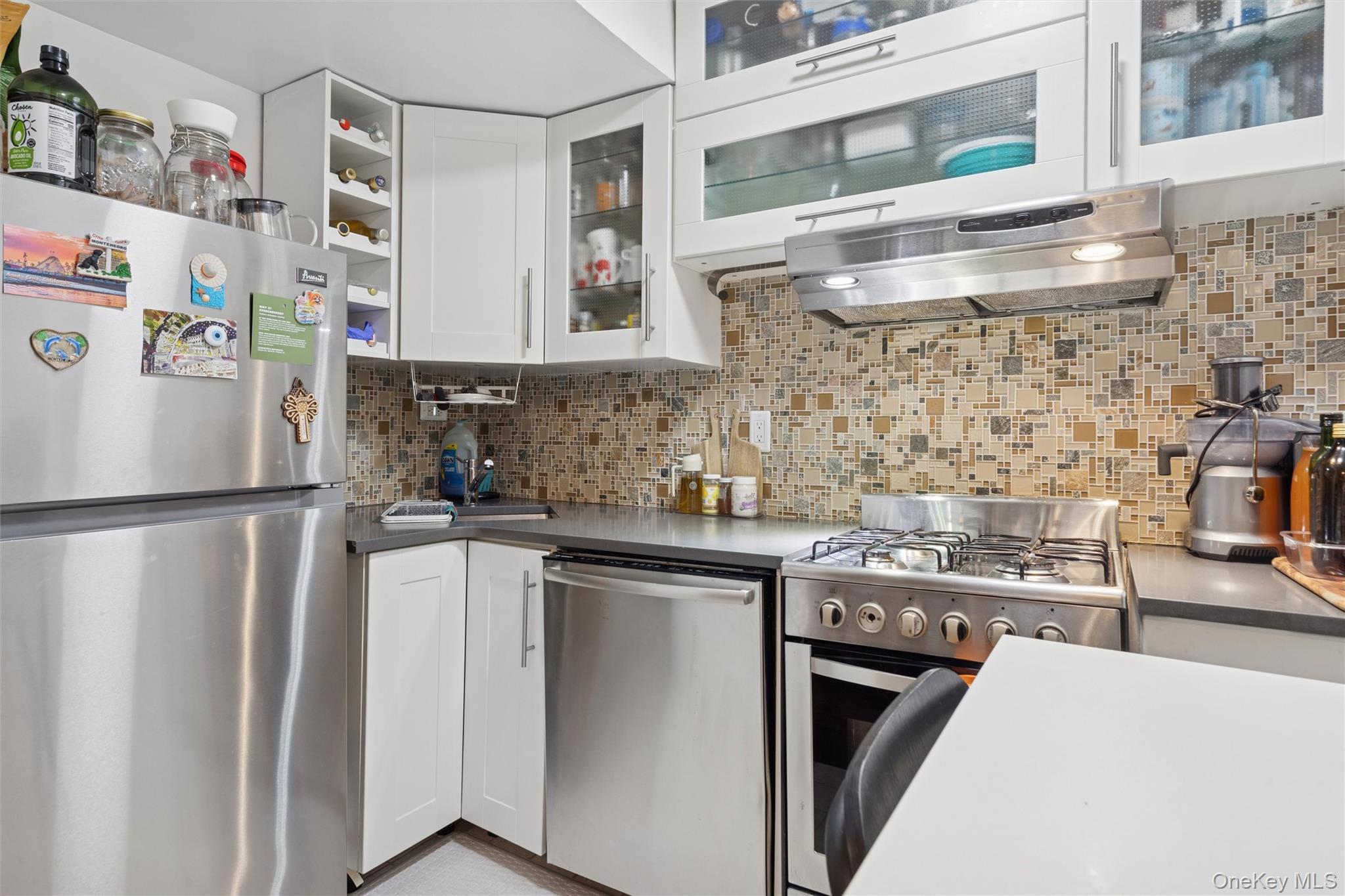 75-02 Austin Street, Unit 2C Queens, NY 11375 - Photo 4 of 6 a kitchen with stainless steel appliances a refrigerator and a sink