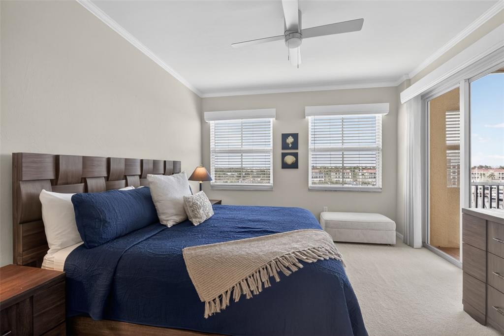 2060 Matecumbe Key Road, Unit 2506 Punta Gorda, FL 33955 - Photo 15 of 38 a bedroom with a bed and glass window
