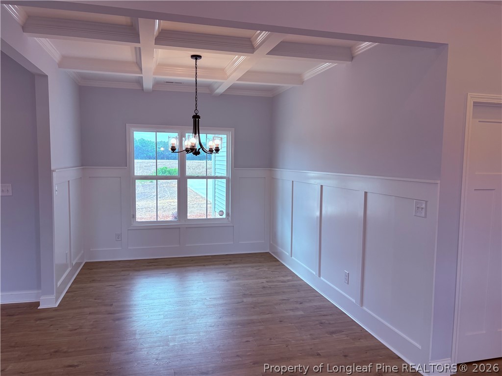 1075 Purdie-Hall Road Tar Heel, NC 28392 - Photo 19 of 28 a view of an empty room with wooden floor and a window