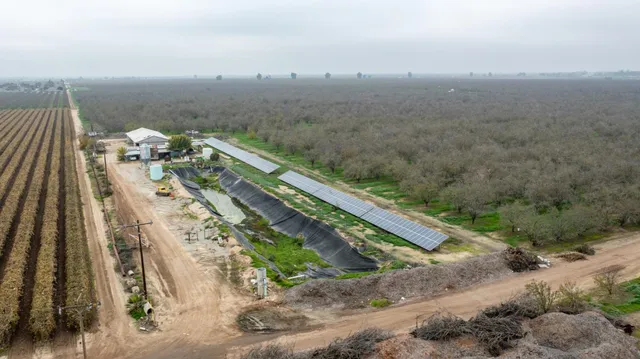 an aerial view of residential house and outdoor space
