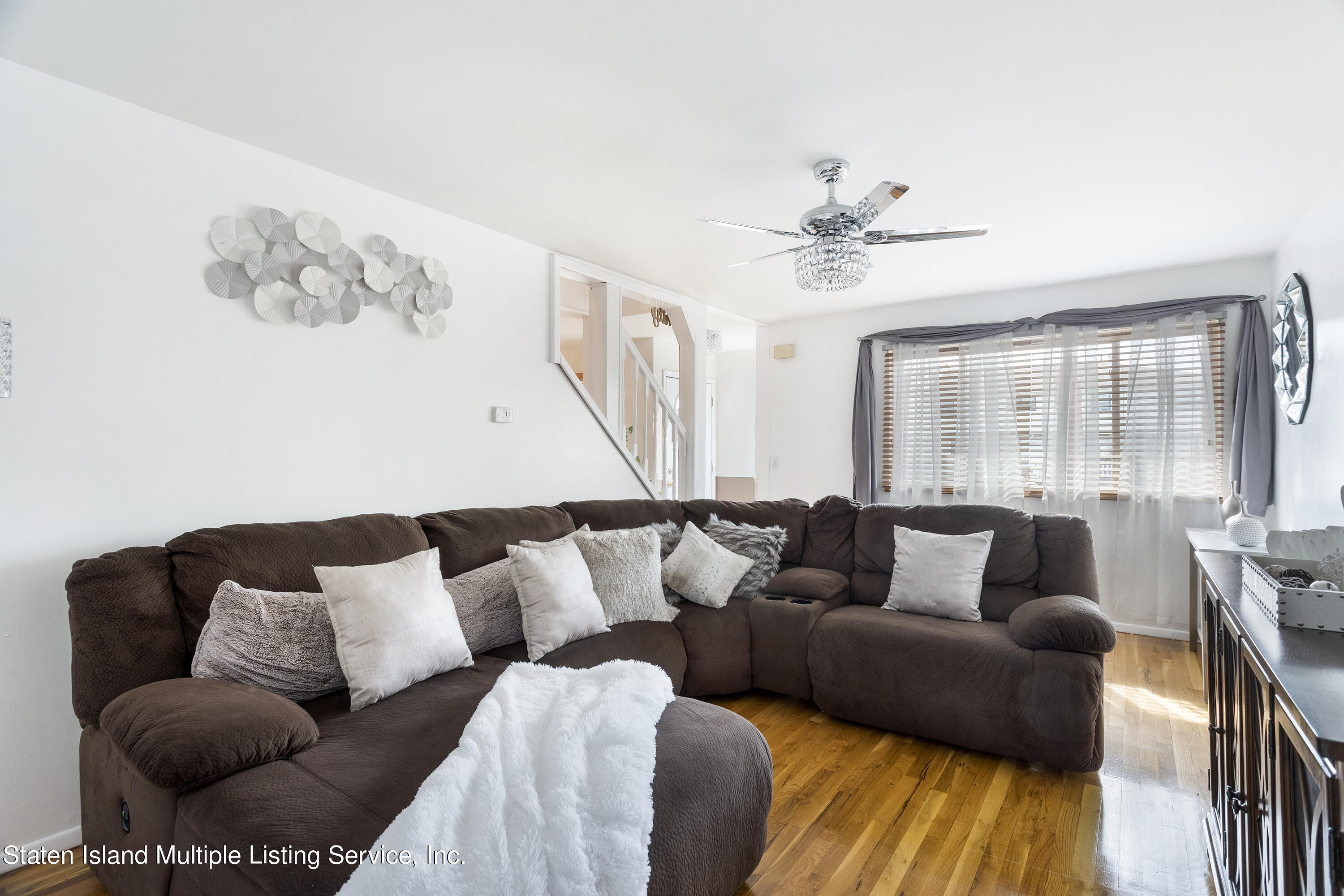 403-1 Willow Road East, Unit 1 Staten Island, NY 10314 - Photo 2 of 14 a living room with furniture and a large window