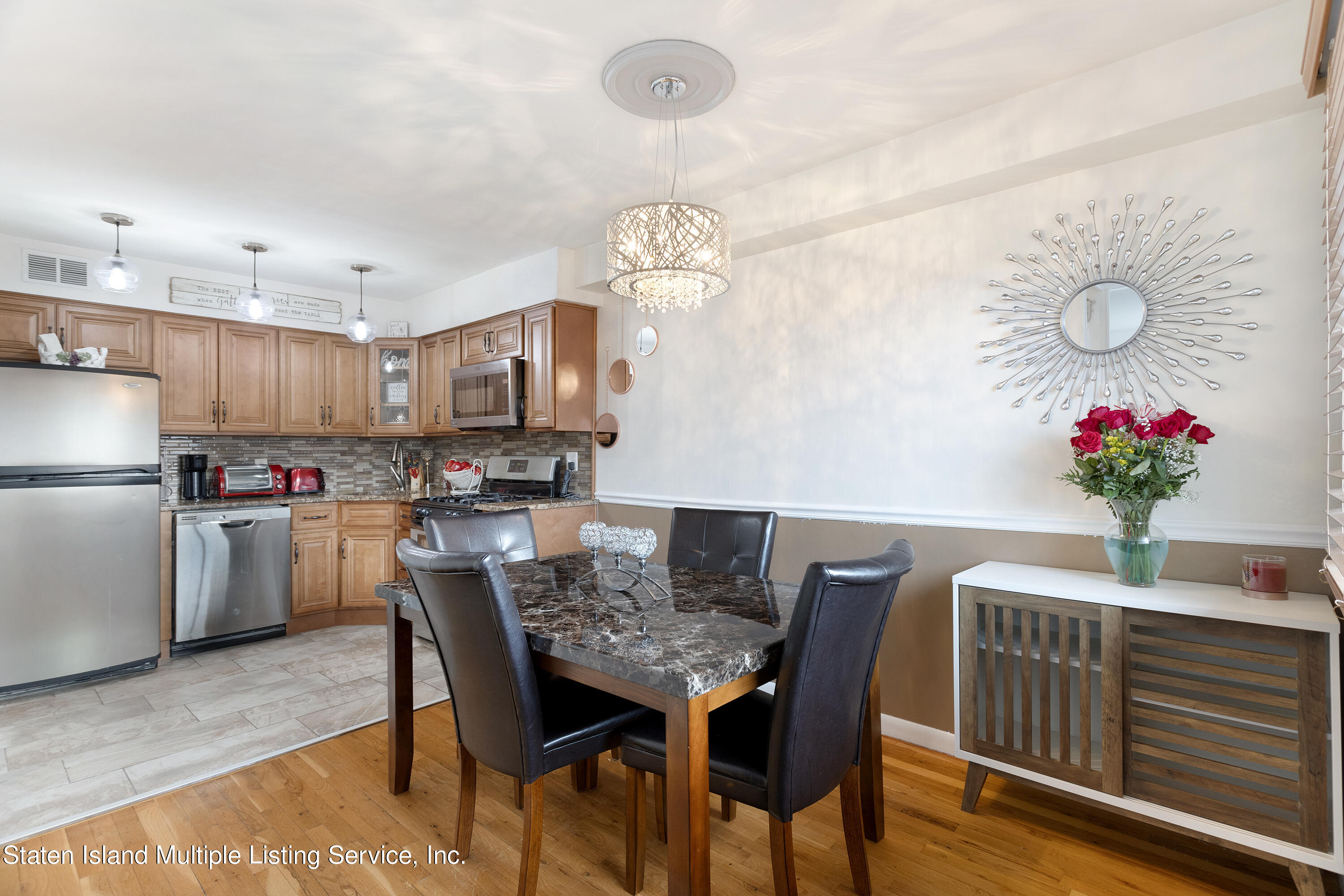 403-1 Willow Road East, Unit 1 Staten Island, NY 10314 - Photo 4 of 14 a dining room with furniture and window