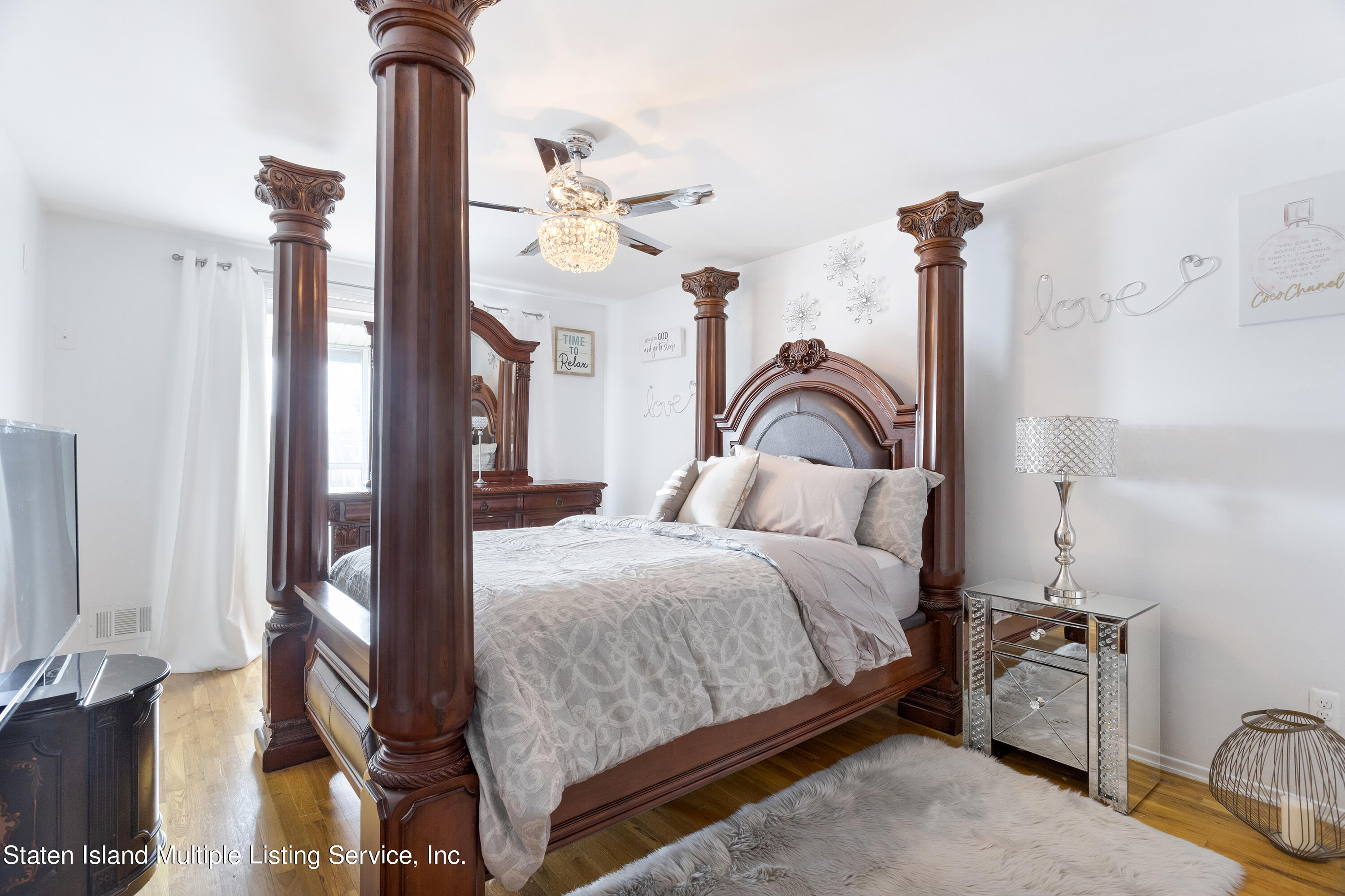 403-1 Willow Road East, Unit 1 Staten Island, NY 10314 - Photo 7 of 14 a bedroom with a bed window and dresser