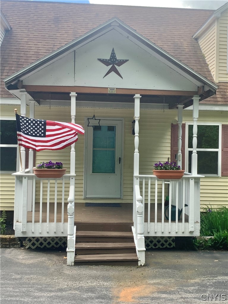 10149 Bailey Lake Road Brookfield, NY 13480 - Photo 6 of 49 Covered front porch provides shelter for family &