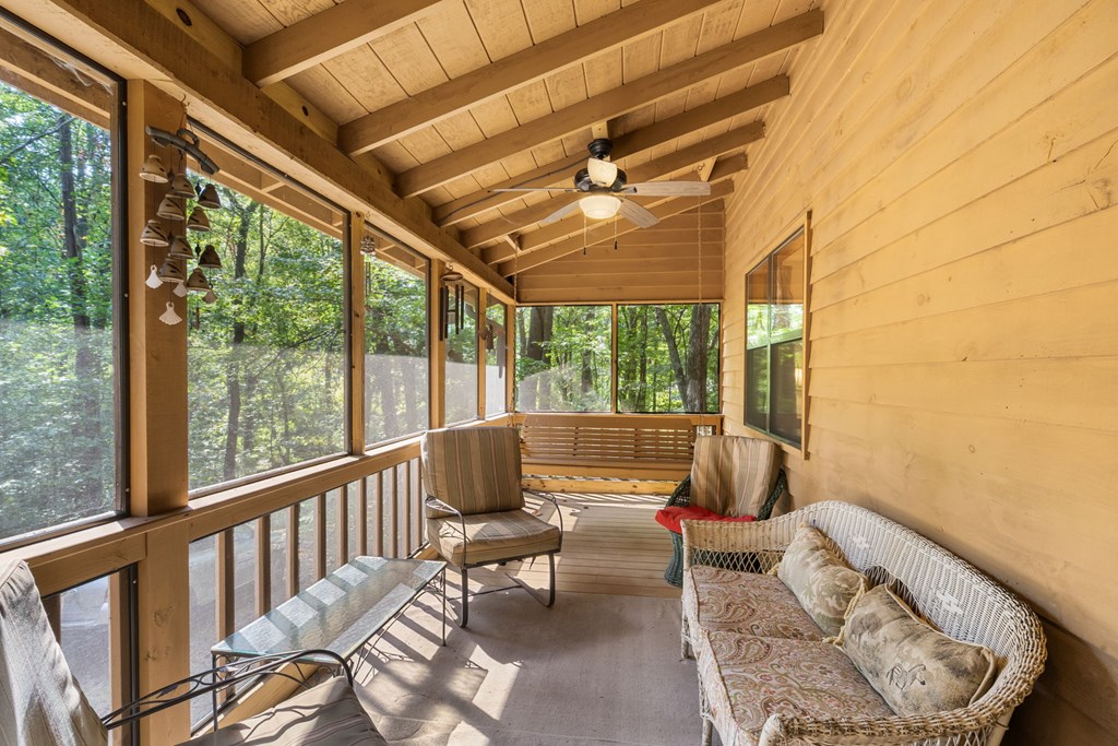 1628 Woods Valley Road Young Harris, GA 30582 - Photo 29 of 36 a living room with furniture and a large window