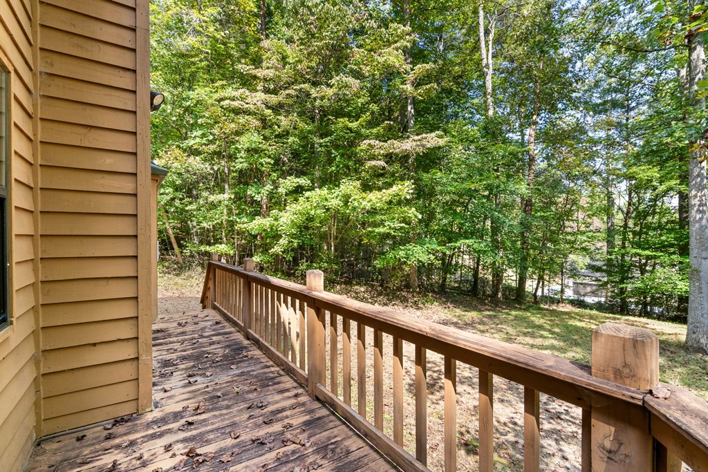 1628 Woods Valley Road Young Harris, GA 30582 - Photo 30 of 36 a view of a balcony with a pot