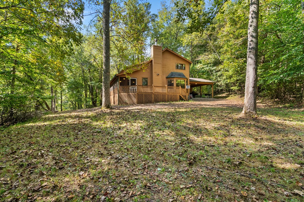 1628 Woods Valley Road Young Harris, GA 30582 - Photo 32 of 36 a front view of a house with a yard