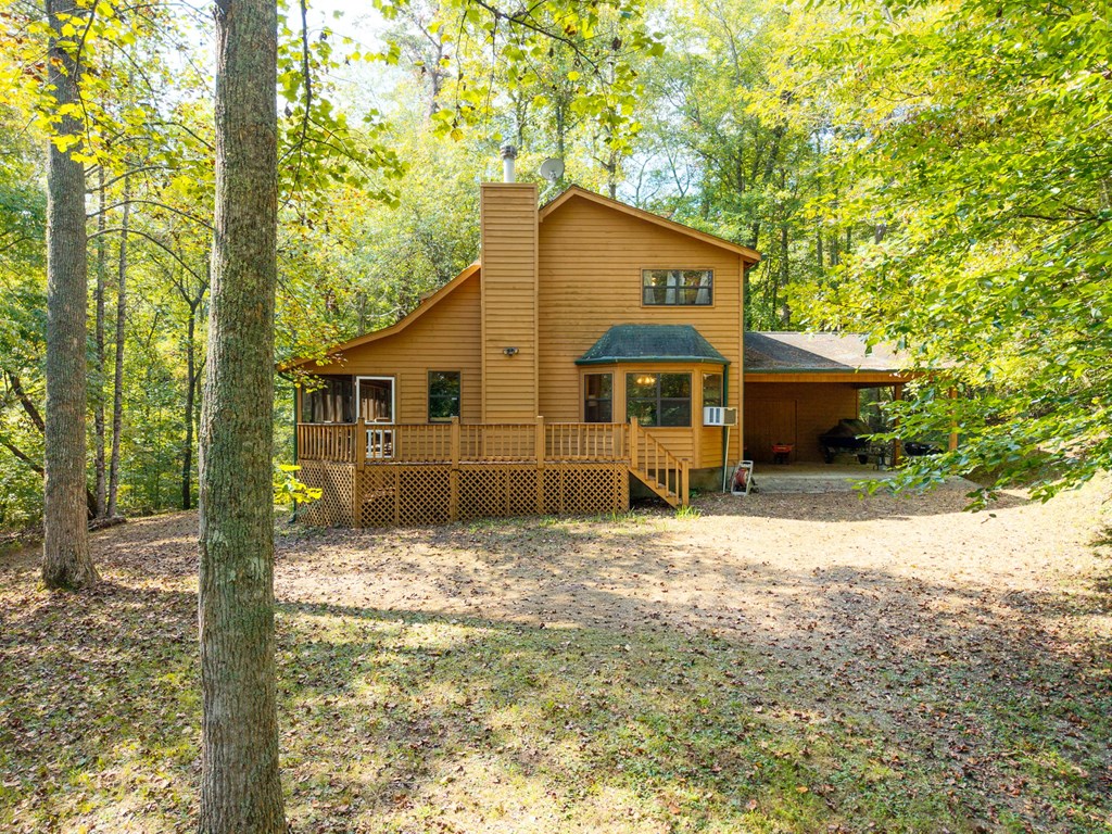 1628 Woods Valley Road Young Harris, GA 30582 - Photo 33 of 36 a house with trees in front of it