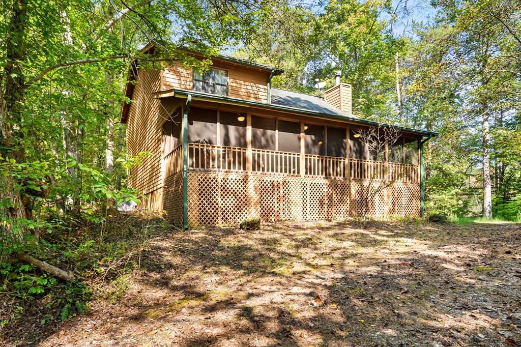 1628 Woods Valley Road Young Harris, GA 30582 - Photo 34 of 36 a front view of a house with a garden