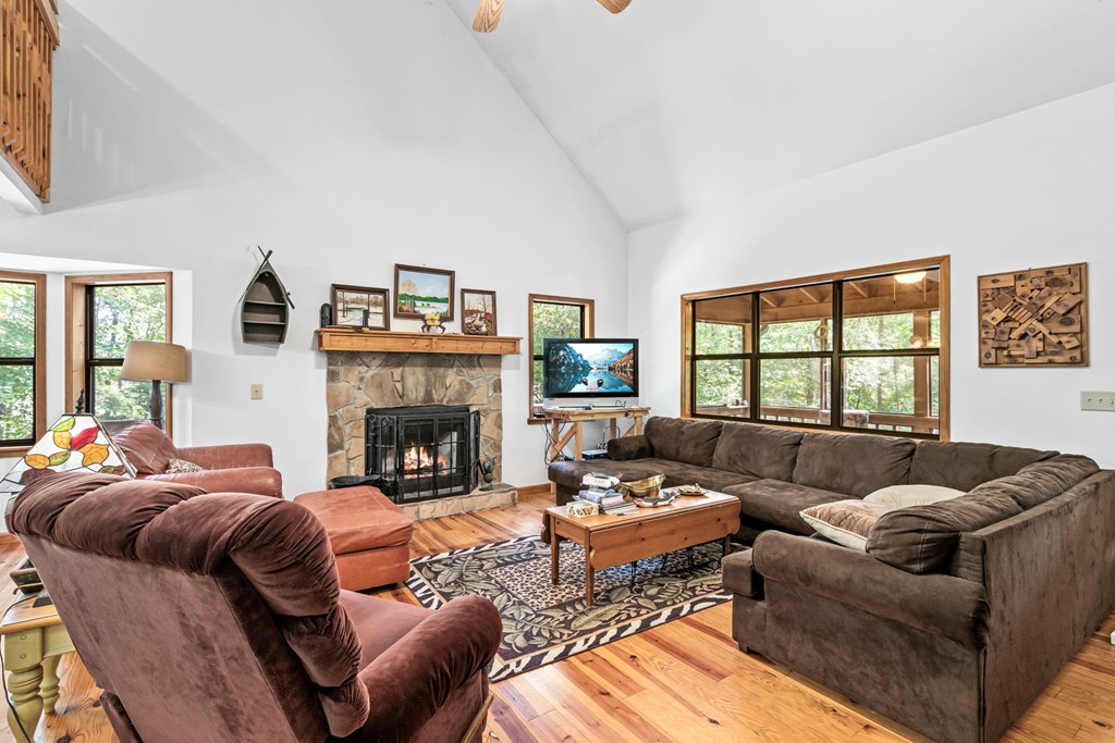 1628 Woods Valley Road Young Harris, GA 30582 - Photo 6 of 36 a living room with furniture and a fireplace