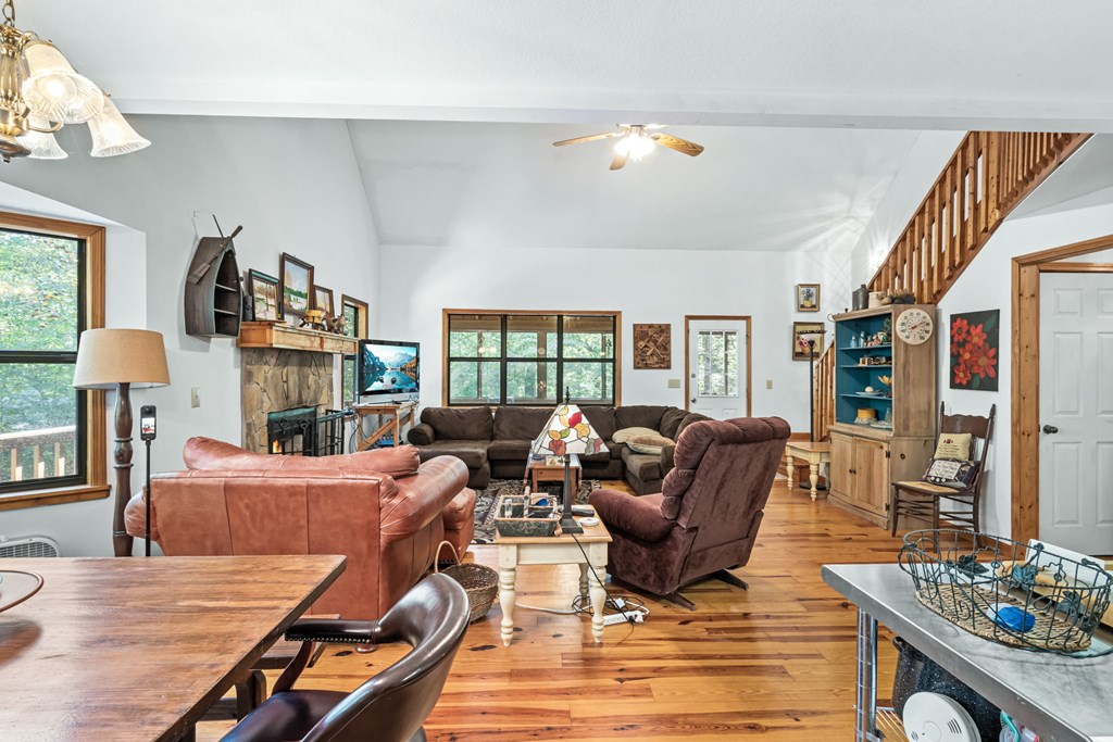 1628 Woods Valley Road Young Harris, GA 30582 - Photo 7 of 36 a living room with furniture and a floor to ceiling window