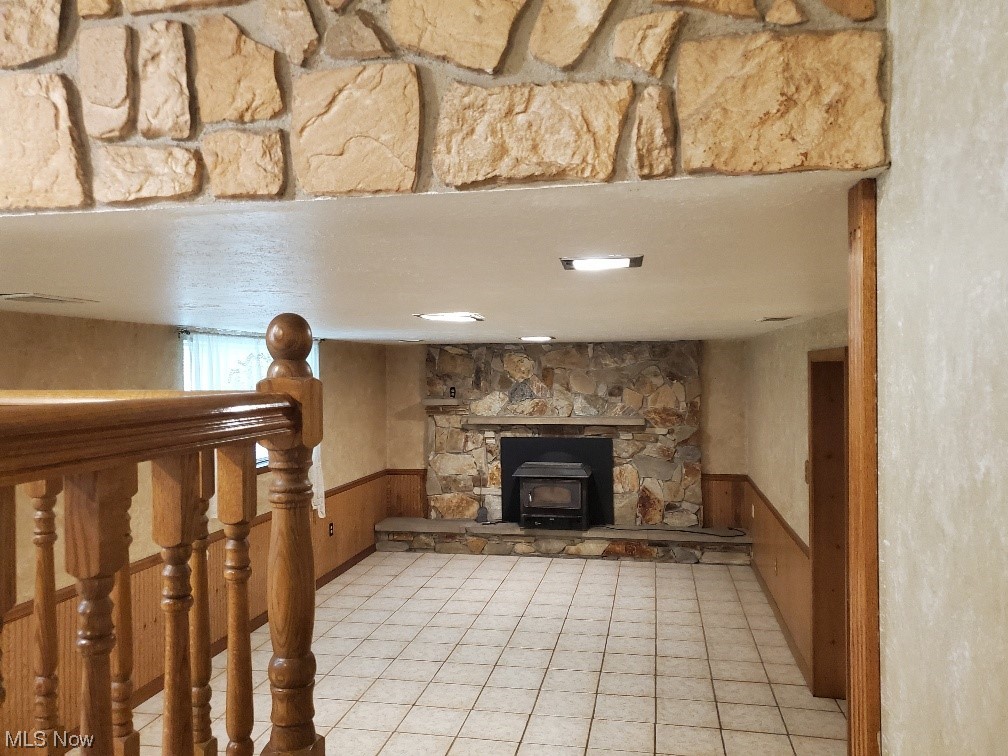 12221 Reno Drive Parma, OH 44130 - Photo 18 of 29 Living room with a fireplace and light tile floors