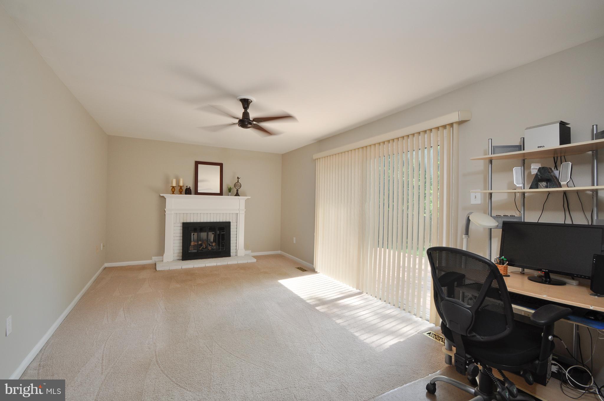 6917 Raspberry Plain Place Springfield, VA 22153 - Photo 11 of 28 Family room with cozy fireplace