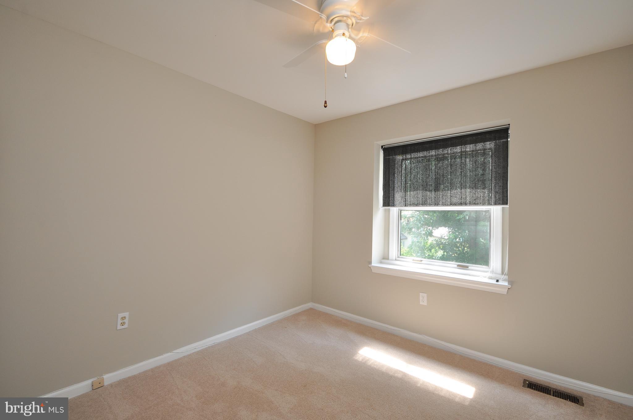 6917 Raspberry Plain Place Springfield, VA 22153 - Photo 20 of 28 Bedroom one with view of yard