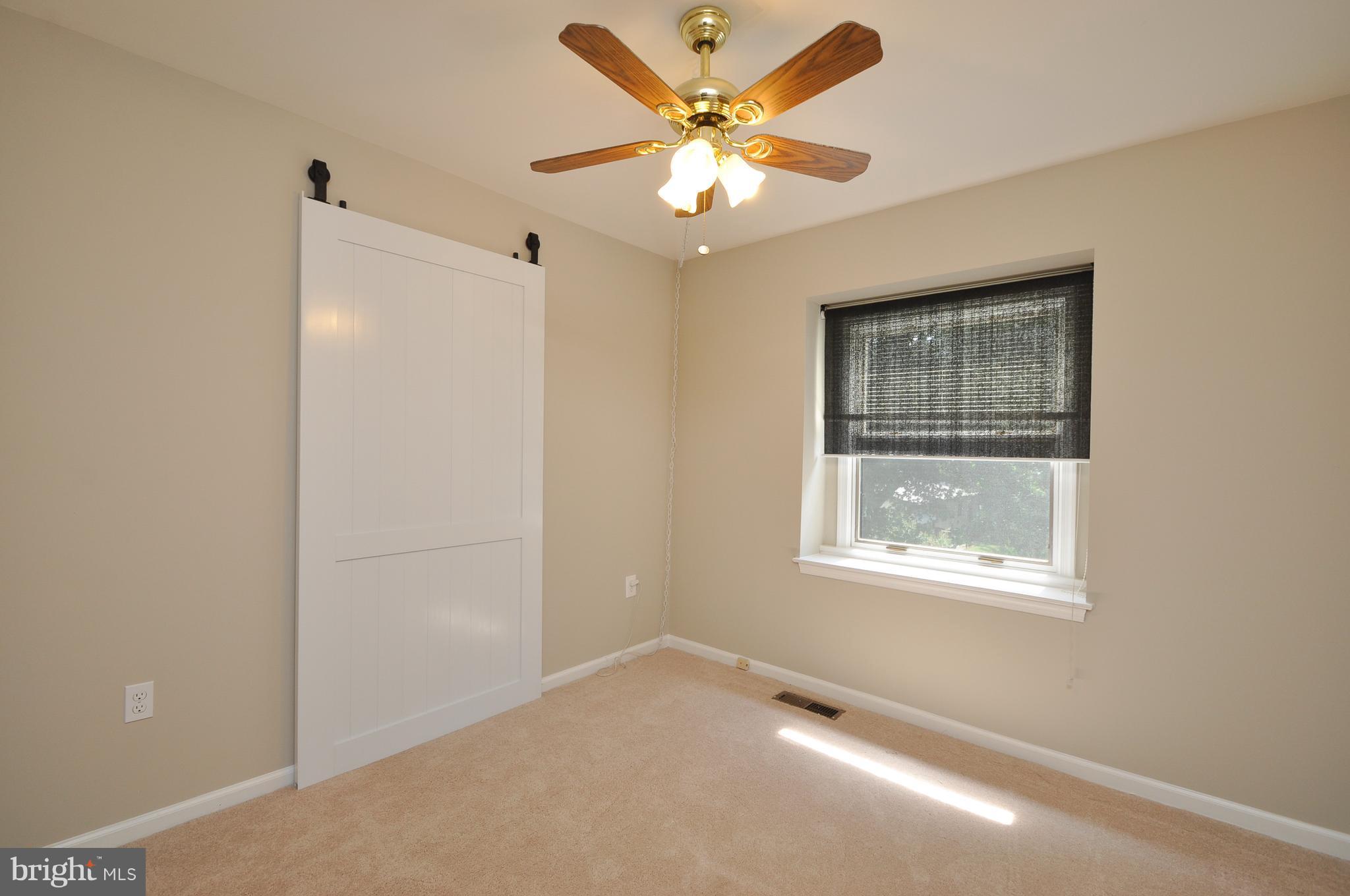 6917 Raspberry Plain Place Springfield, VA 22153 - Photo 21 of 28 Bedroom two with barn door