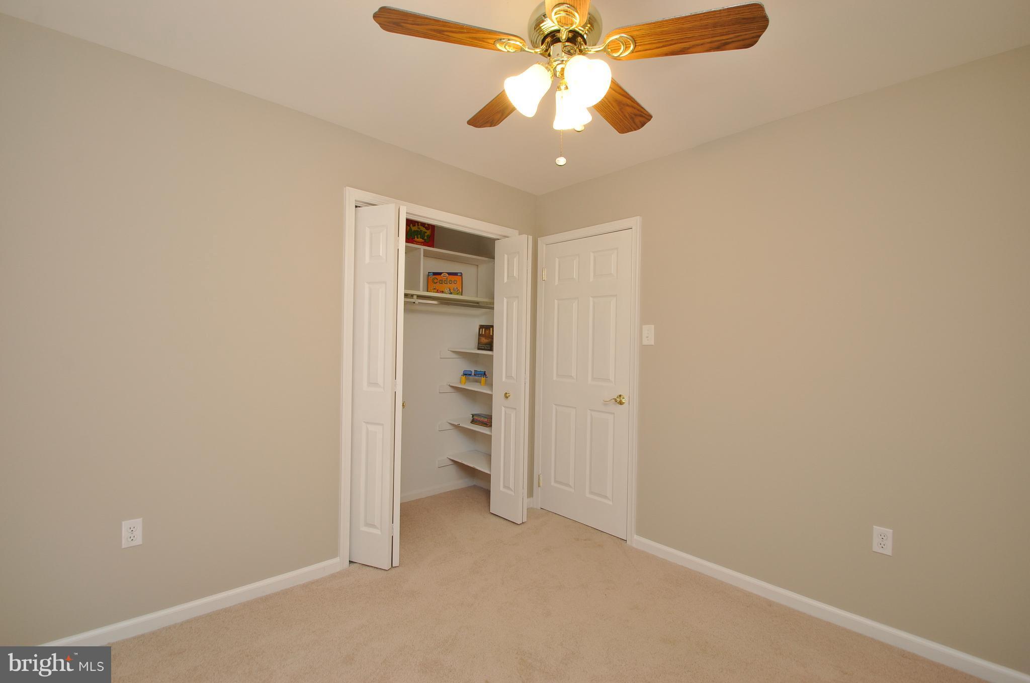 6917 Raspberry Plain Place Springfield, VA 22153 - Photo 22 of 28 Bedroom two with extra closet shelving