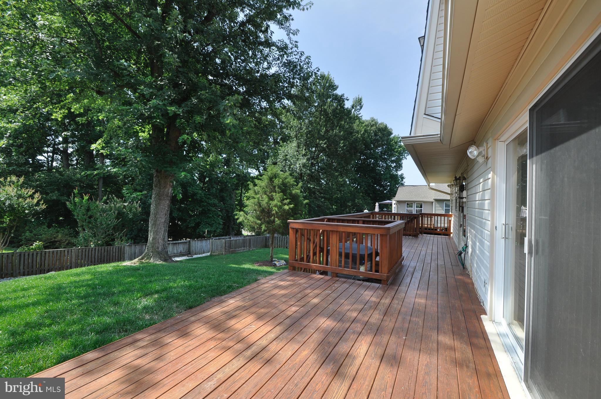 6917 Raspberry Plain Place Springfield, VA 22153 - Photo 27 of 28 Huge deck with well manicured lawn and fenced yard