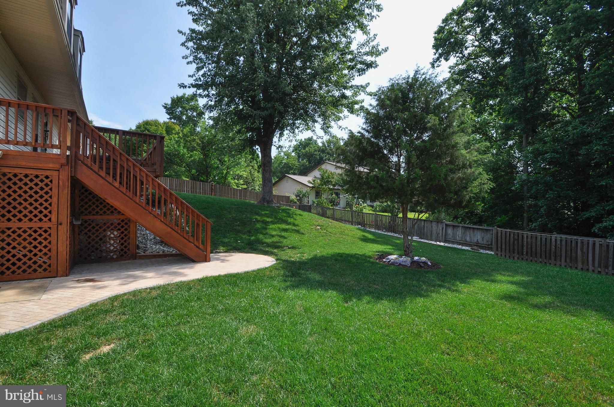 6917 Raspberry Plain Place Springfield, VA 22153 - Photo 28 of 28 Custom brick patio and river rock bed