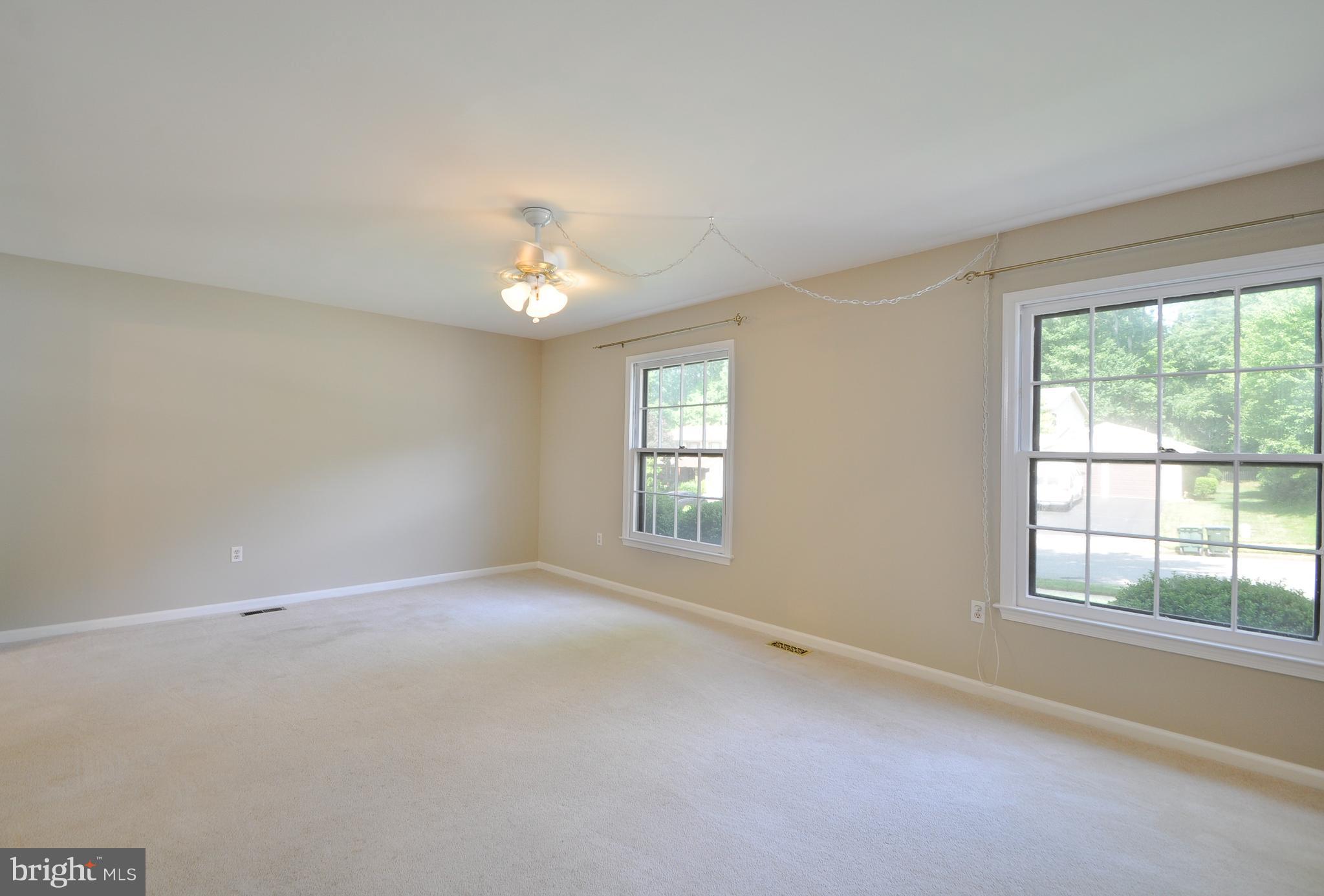 6917 Raspberry Plain Place Springfield, VA 22153 - Photo 4 of 28 Large living room with lots of natural light