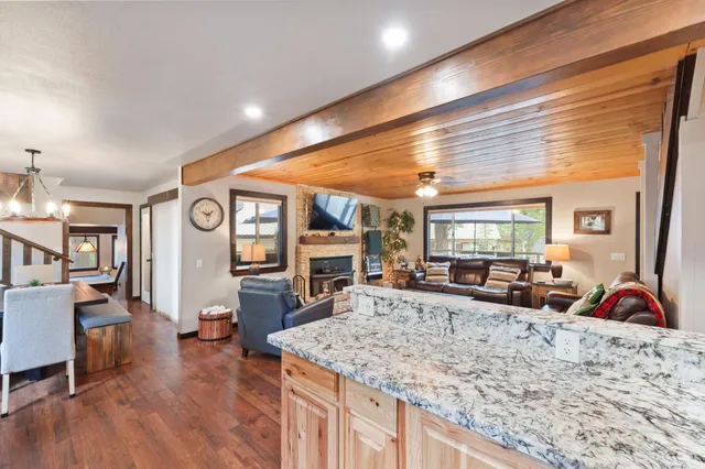 a view of living room with granite countertop furniture and fireplace