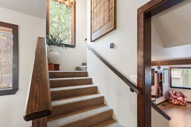 a view of entryway and hall with wooden floor