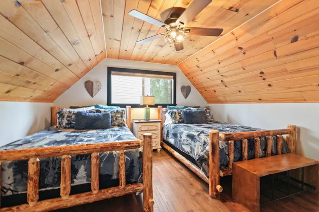 a bedroom with furniture and a chandelier