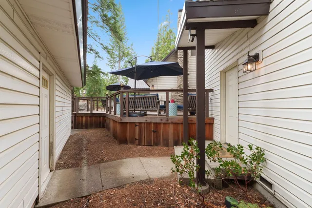 a view of a porch with wooden floor