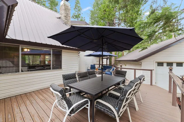 an outdoor space with furniture and umbrella