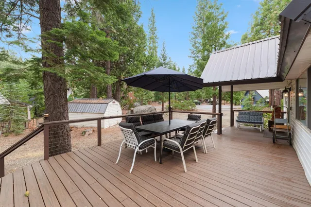 an outdoor space with furniture and wooden floor