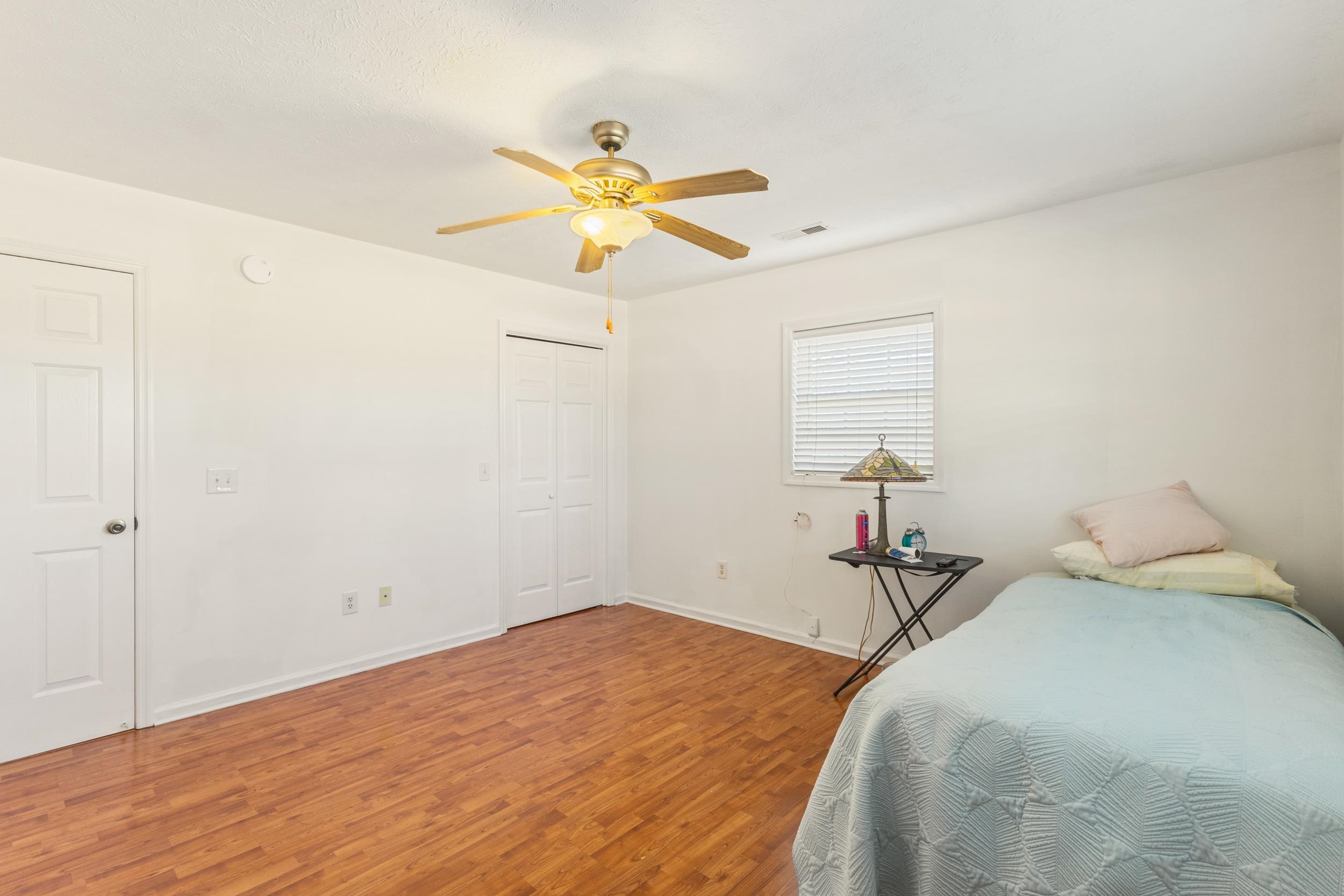 3923 State Rd S-26-33 Green Sea, SC 29545 - Photo 32 of 40 Bedroom featuring light wood-type flooring, ceiling fan, and a closet