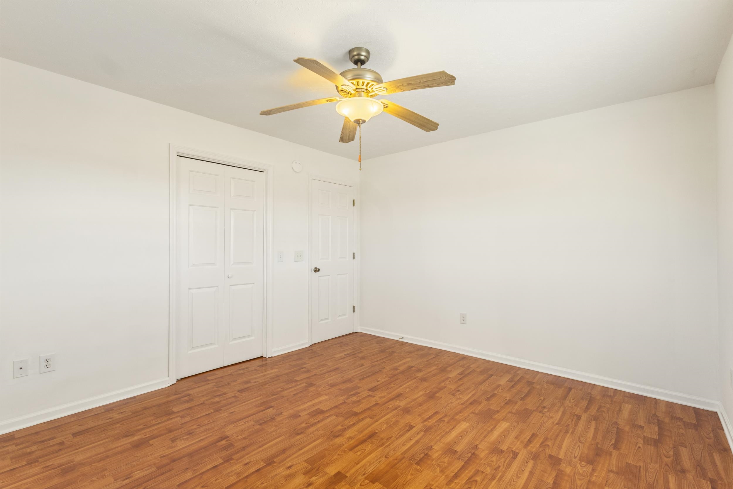 3923 State Rd S-26-33 Green Sea, SC 29545 - Photo 34 of 40 Unfurnished bedroom featuring ceiling fan, wood finished floors, and a closet