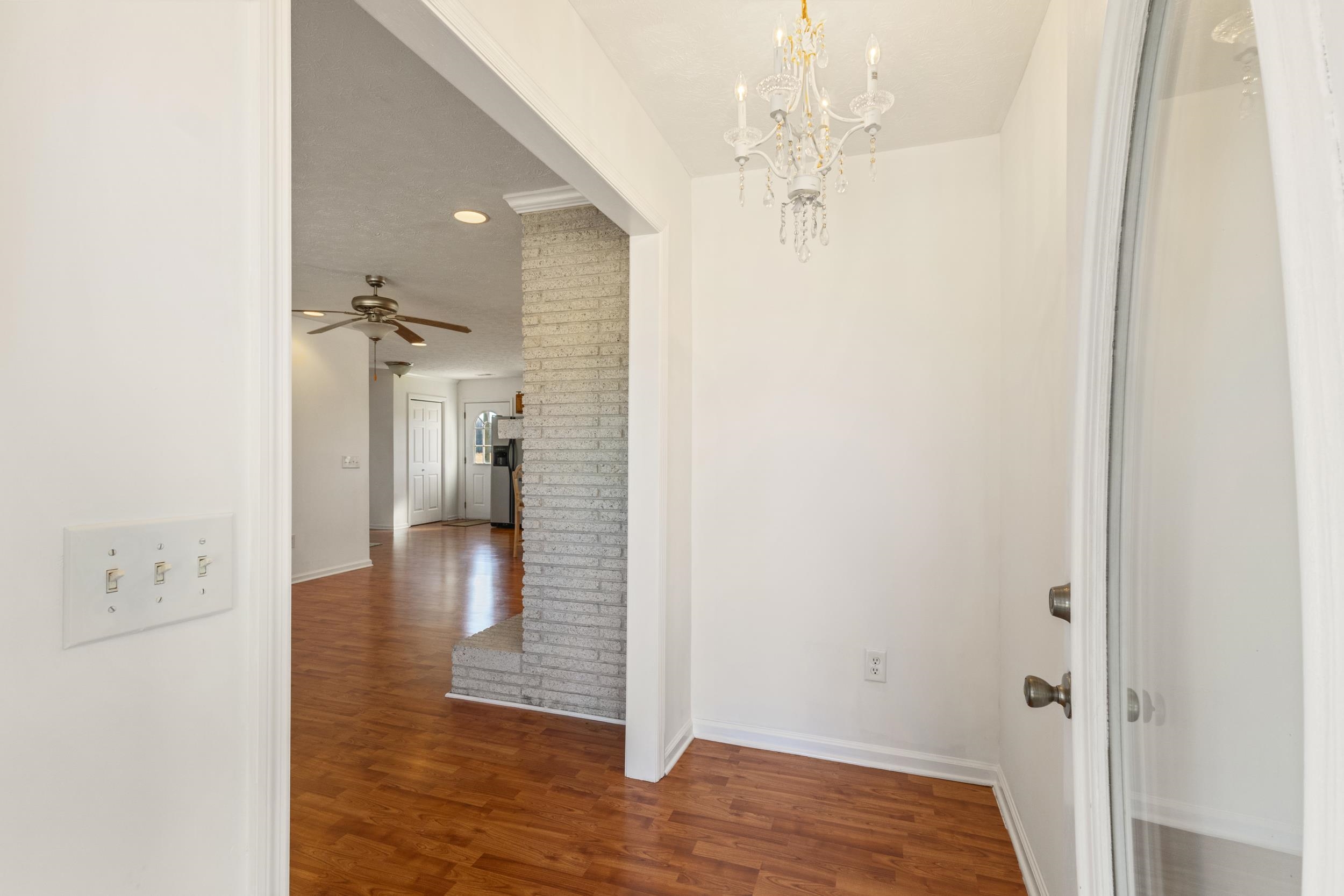 3923 State Rd S-26-33 Green Sea, SC 29545 - Photo 8 of 40 Hallway featuring dark wood-type flooring, a chandelier, and recessed lighting