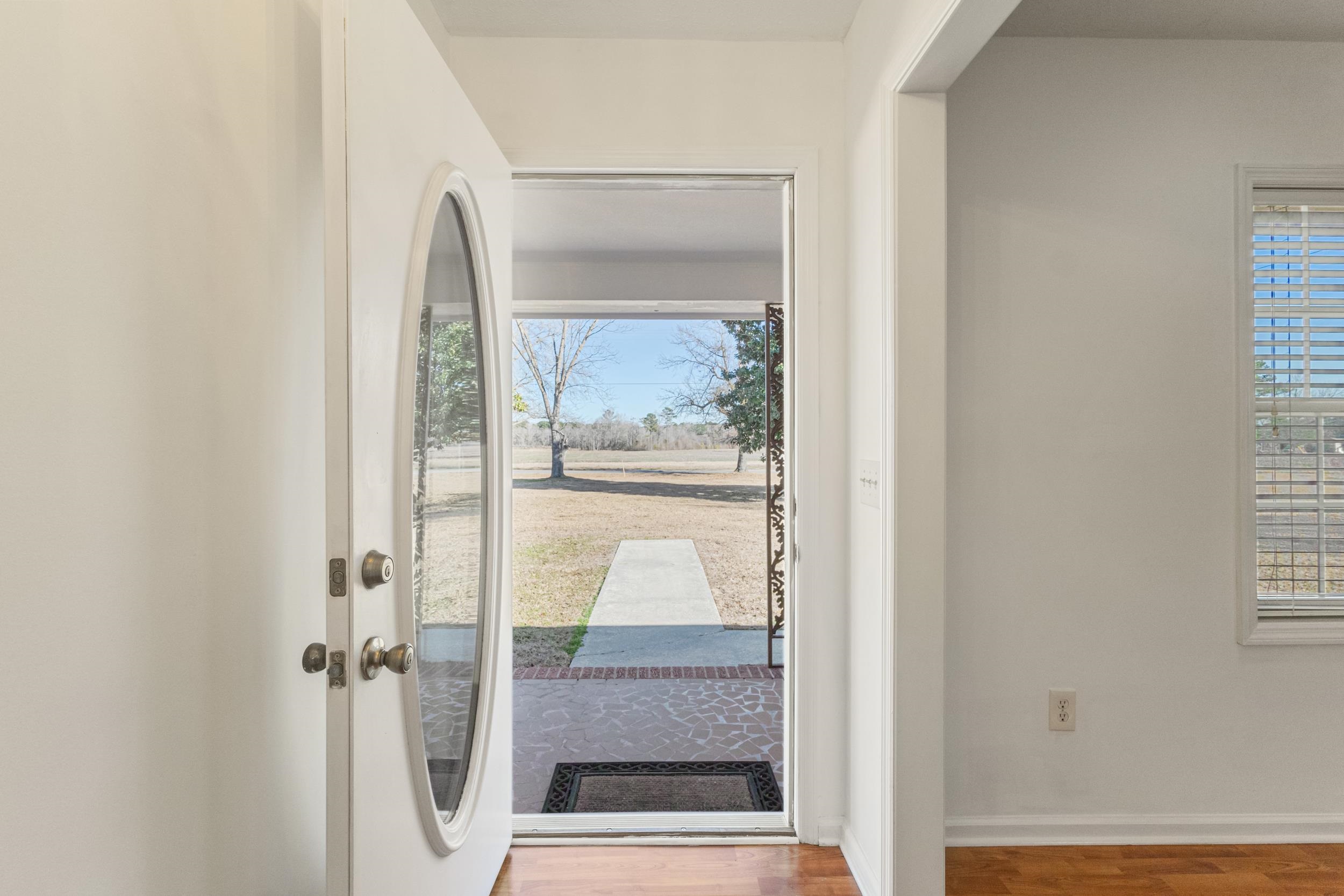 3923 State Rd S-26-33 Green Sea, SC 29545 - Photo 9 of 40 Doorway to outside featuring wood finished floors and baseboards