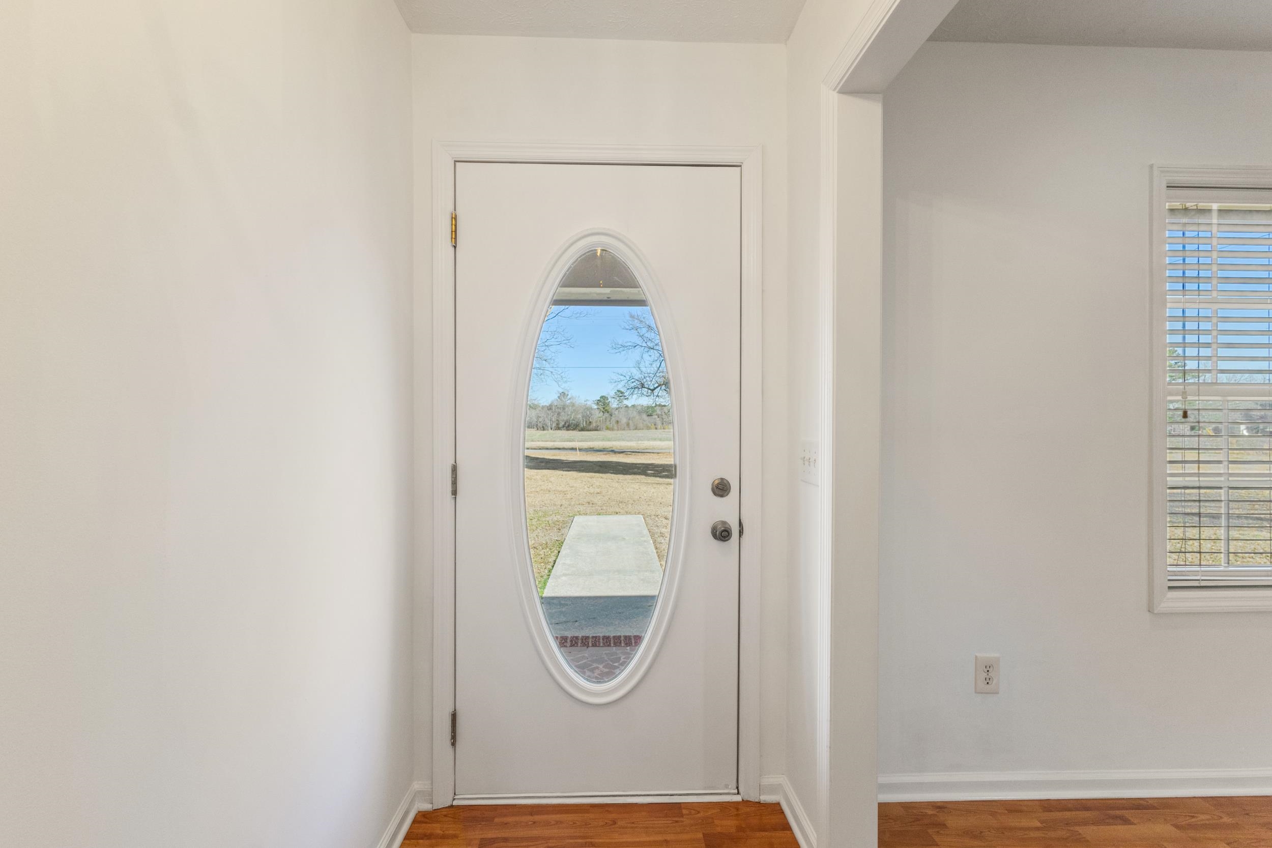 3923 State Rd S-26-33 Green Sea, SC 29545 - Photo 10 of 40 Entryway with baseboards and wood finished floors